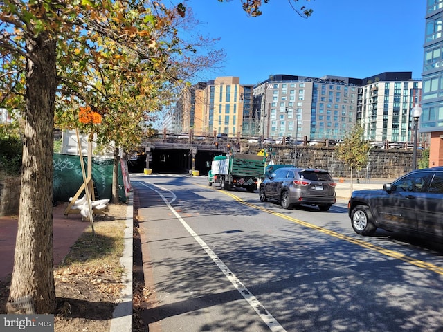 view of street with a city view and curbs