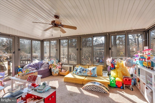 sunroom / solarium featuring ceiling fan