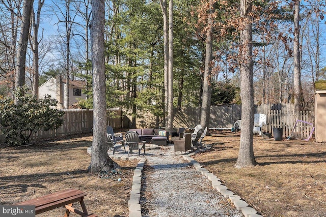 view of yard with fence private yard, a patio area, and an outdoor hangout area