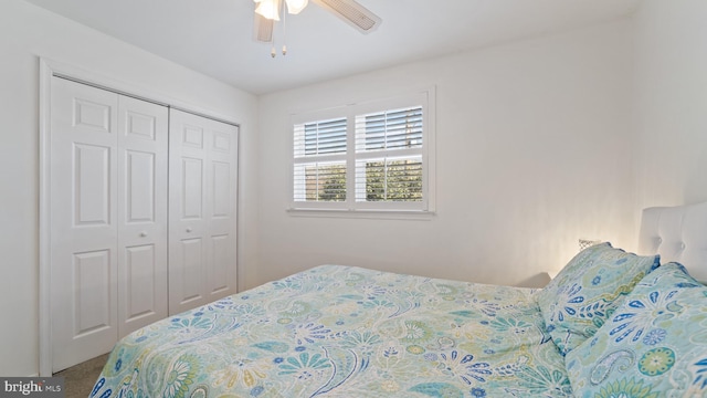 bedroom with a ceiling fan, carpet, and a closet