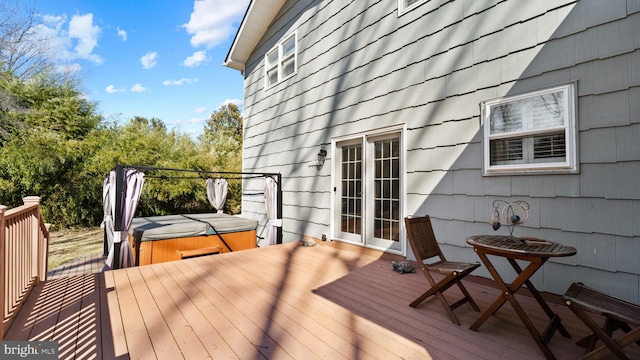 deck with a hot tub