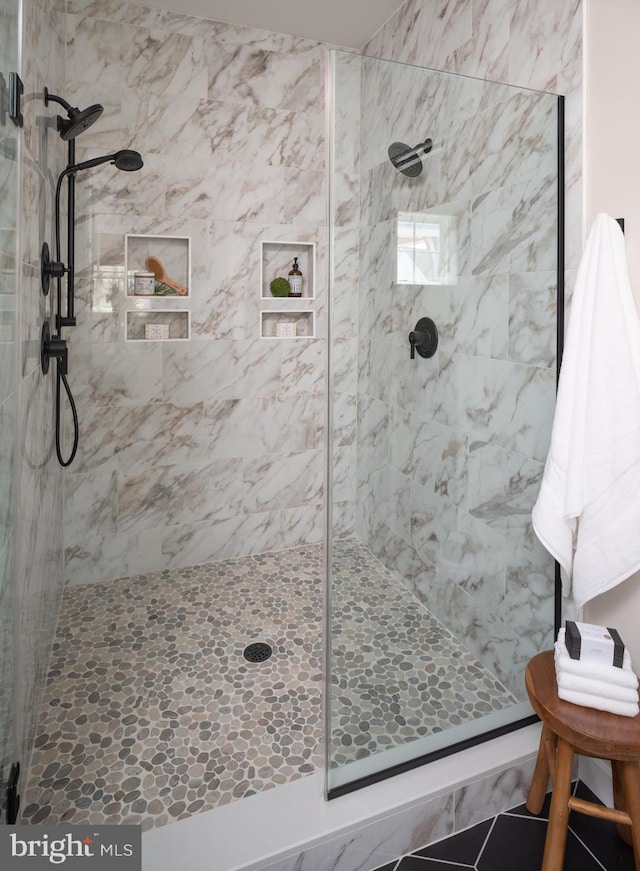 bathroom with tiled shower