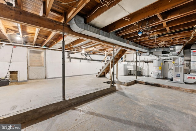 unfinished basement featuring water heater, a sink, stairs, and heating unit