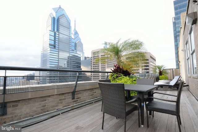 wooden deck with a city view