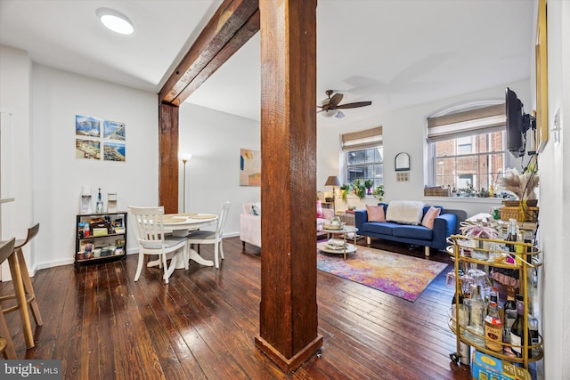 dining room with baseboards, ceiling fan, and hardwood / wood-style floors