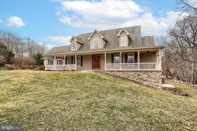 view of front of house featuring a front yard, covered porch, roof with shingles, and ceiling fan