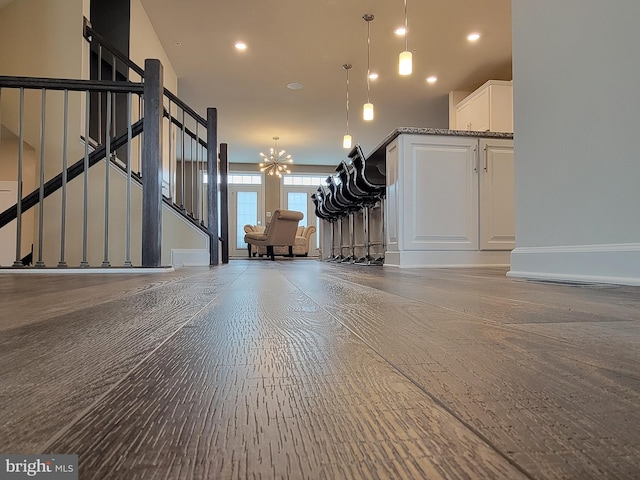 interior space featuring stairs, recessed lighting, a chandelier, and baseboards