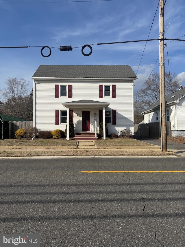 traditional home with fence