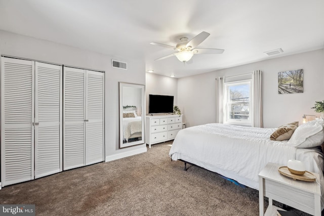 carpeted bedroom featuring baseboards, visible vents, a closet, and ceiling fan