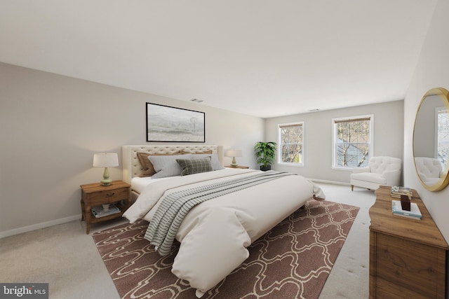 bedroom with carpet floors, visible vents, and baseboards