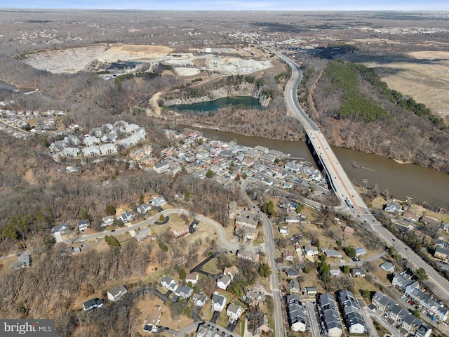 drone / aerial view with a water view and a residential view