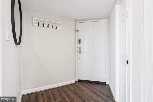 entryway with baseboards and dark wood finished floors