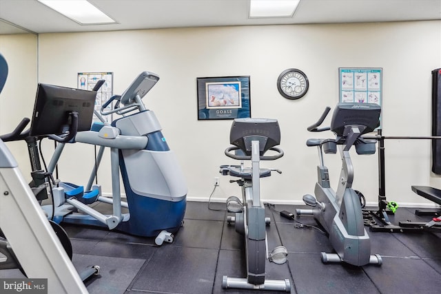 exercise room with baseboards