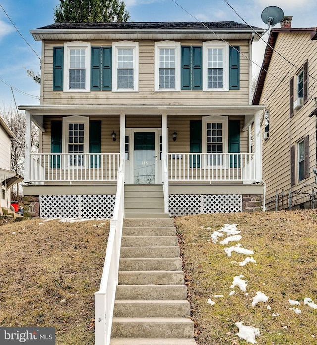 view of front of house featuring stairs and a porch