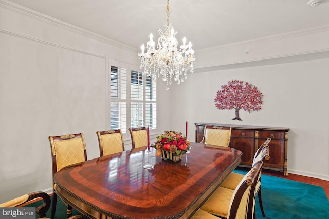 dining space featuring an inviting chandelier, crown molding, and baseboards