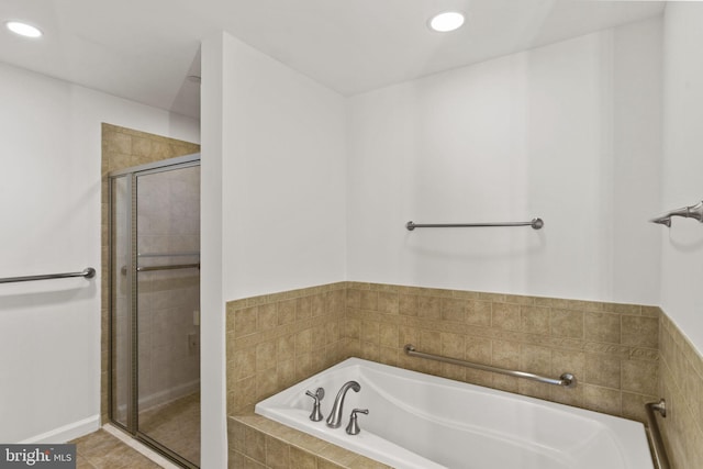 bathroom featuring tile patterned floors, a stall shower, recessed lighting, and a bath