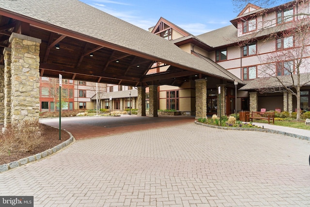 view of community with curved driveway