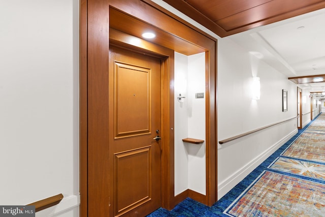 hallway featuring baseboards