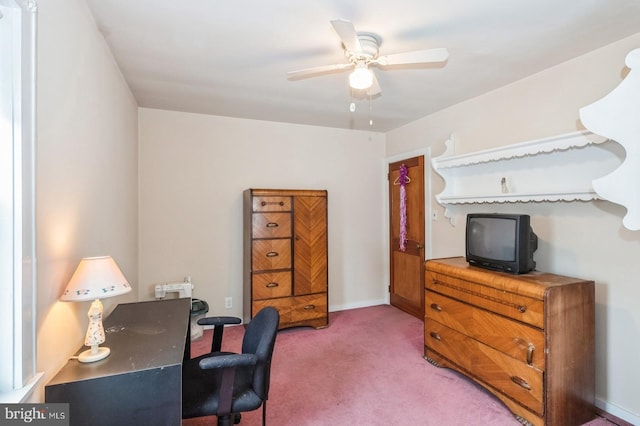 office area with baseboards, light colored carpet, and a ceiling fan