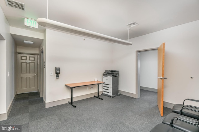 interior space with carpet flooring, visible vents, and baseboards