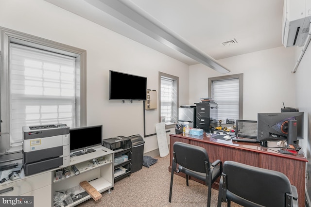 home office with visible vents and light colored carpet