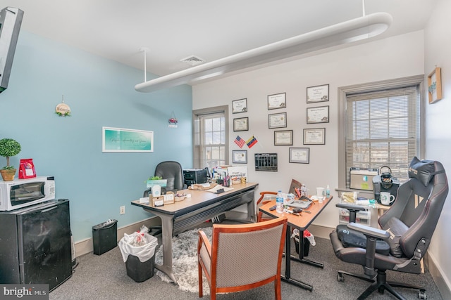 office area with baseboards and visible vents