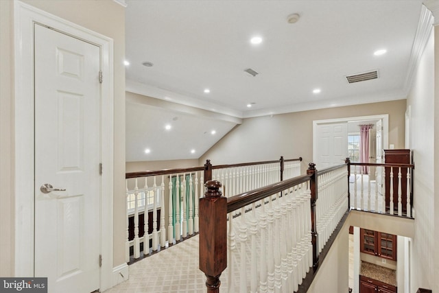 corridor with recessed lighting, visible vents, an upstairs landing, vaulted ceiling, and crown molding