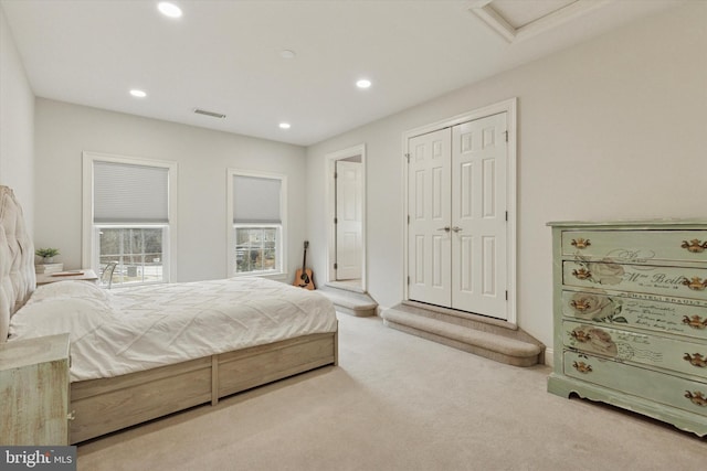 bedroom featuring attic access, visible vents, carpet floors, a closet, and recessed lighting