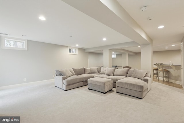 living area with baseboards, visible vents, carpet flooring, and recessed lighting