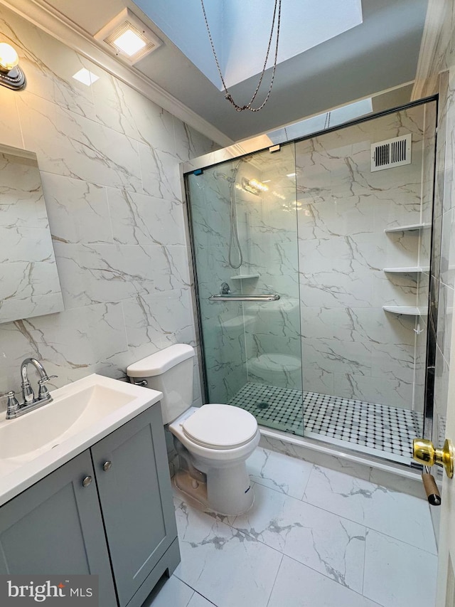 full bathroom featuring a marble finish shower, visible vents, toilet, ornamental molding, and marble finish floor