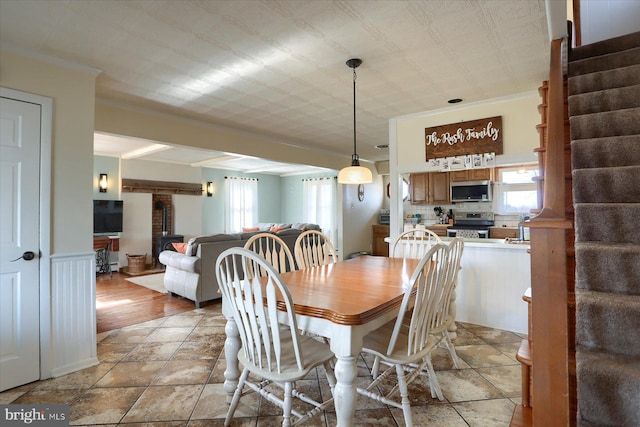 dining area featuring crown molding