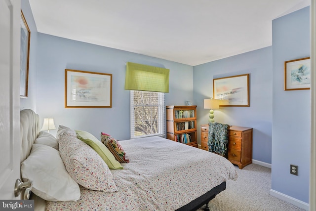 bedroom featuring carpet flooring and baseboards