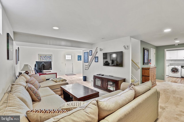 living room featuring light carpet, baseboards, stairway, and recessed lighting