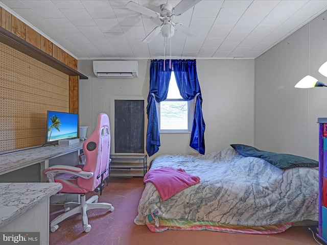 bedroom with a wall unit AC, wood walls, a ceiling fan, and concrete flooring