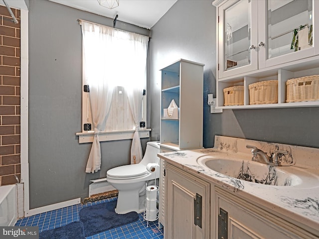 full bath featuring toilet, tile patterned floors, a bathtub, and vanity