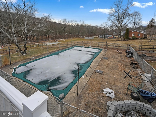 view of pool with fence