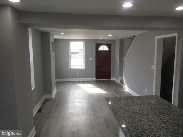 entryway with visible vents, baseboards, wood finished floors, and recessed lighting