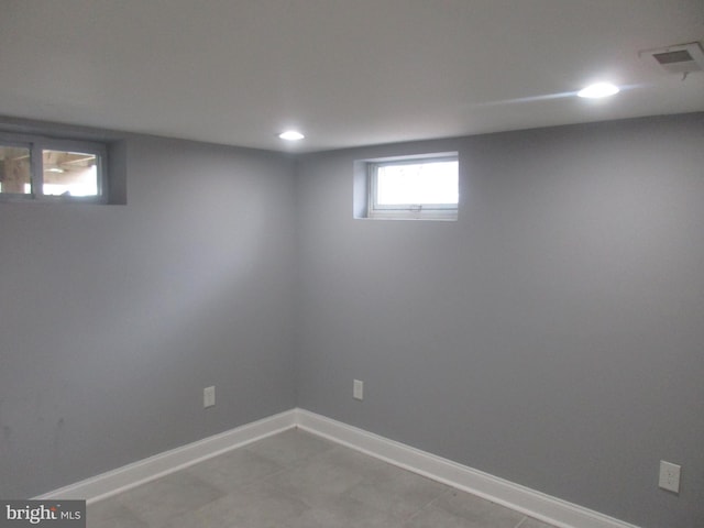 below grade area featuring recessed lighting, visible vents, and baseboards