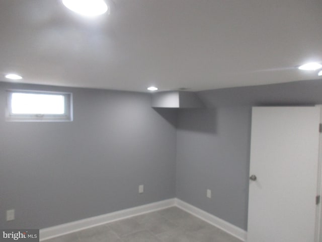 basement featuring recessed lighting and baseboards