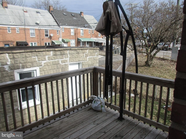 wooden terrace featuring a residential view