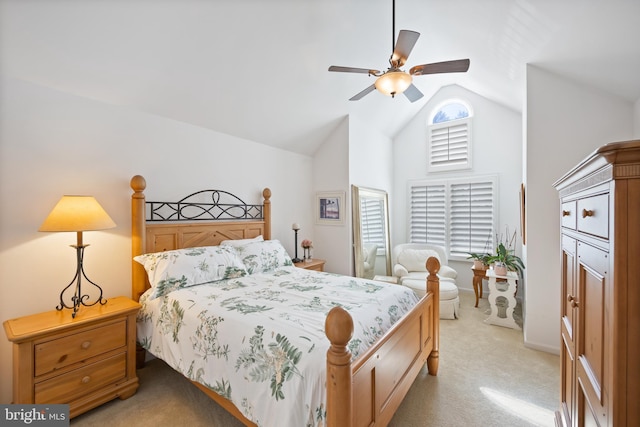 bedroom featuring light colored carpet, a ceiling fan, and high vaulted ceiling