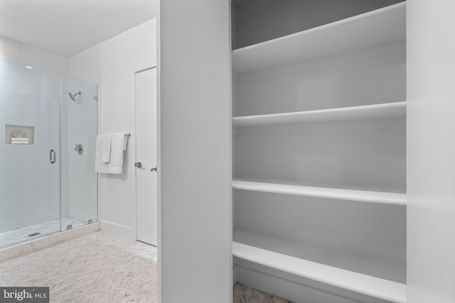 bathroom featuring a shower stall