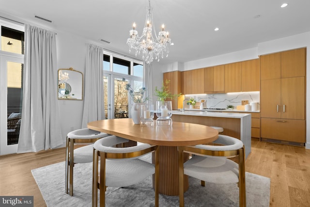 dining area featuring recessed lighting, visible vents, and light wood-style floors