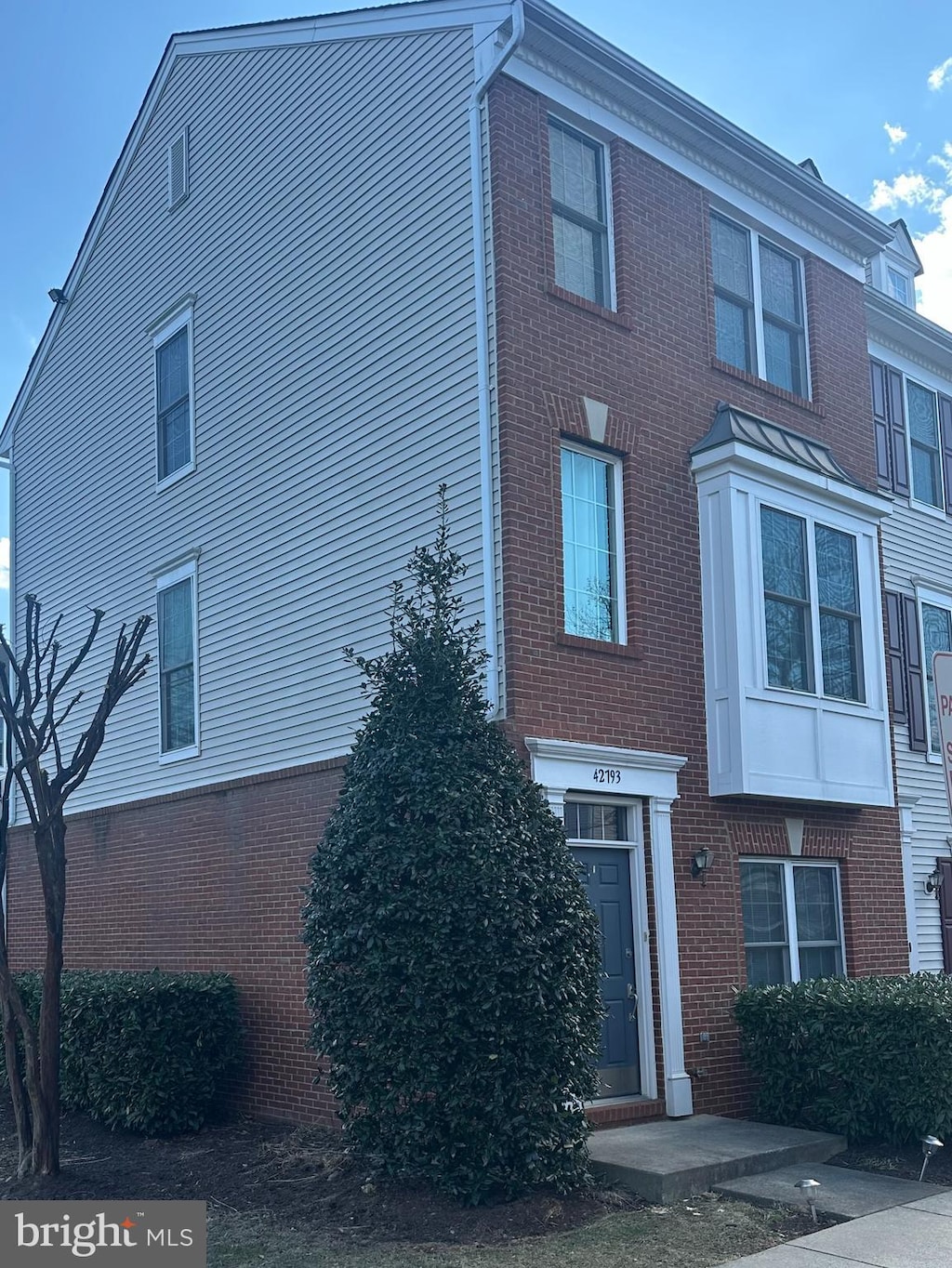 exterior space with brick siding