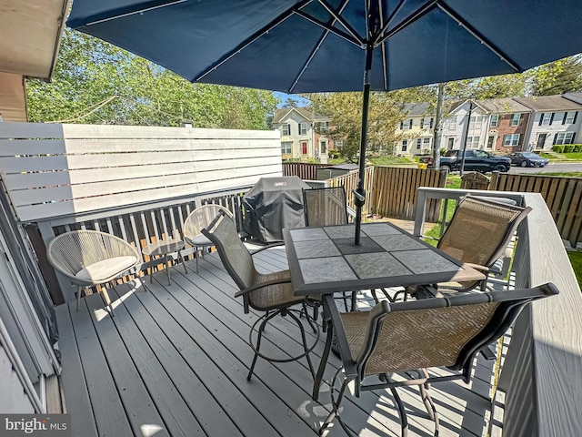 103 Foxbay Ln, Glen Burnie, MD 21061 - deck with outdoor dining space, a residential view, fence, and a grill