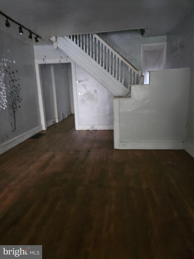 interior space featuring stairway and wood finished floors