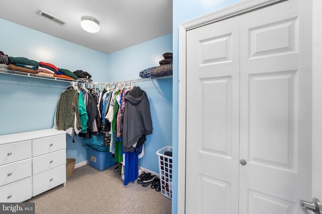 spacious closet with visible vents and light carpet