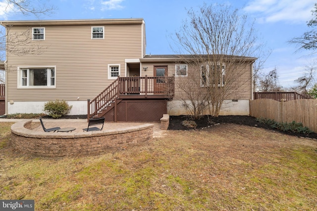 back of house featuring a yard, a patio, crawl space, fence, and a wooden deck