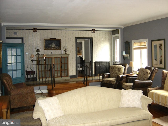 living room with crown molding, baseboards, wood finished floors, and wallpapered walls