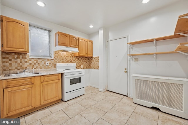 kitchen with white range with electric cooktop, radiator, decorative backsplash, a sink, and under cabinet range hood